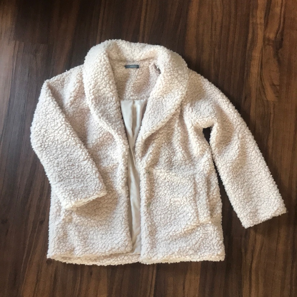 Light blush colored fuzzy coat